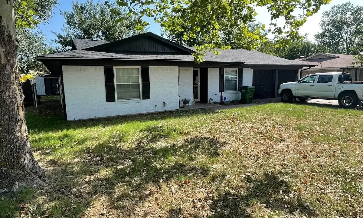 Professional roofing crew working on a residential roof in Schertz